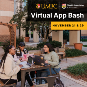 Students sitting at a table at USG with laptops